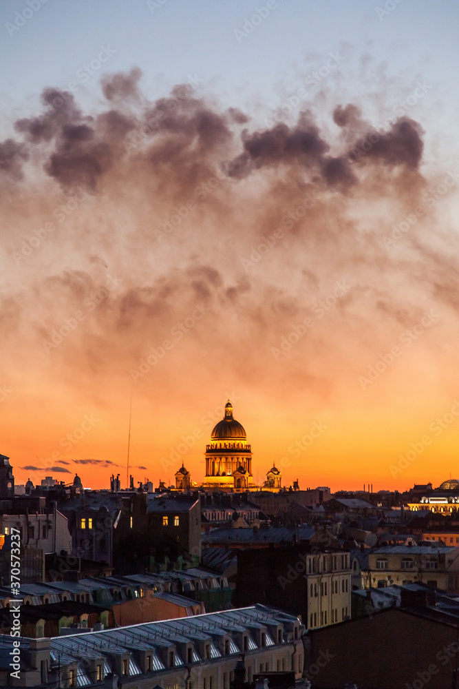 Sunset cityscape of Saint Petersburg with smoke after fireworks
