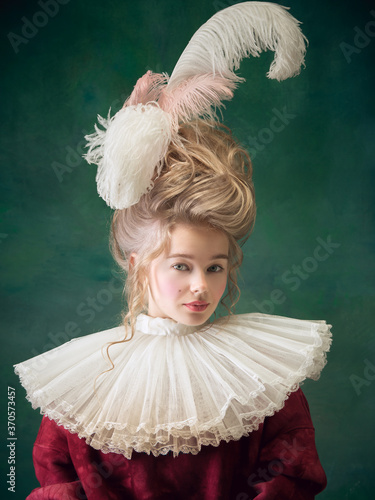 Photo Young and beautiful woman as Marie Antoinette isolated on dark green background