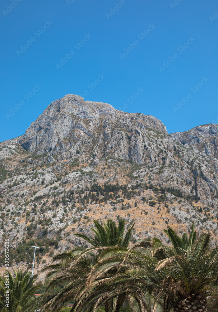 The rugged mountains surrounding the historic walled city of Kotor, Montenegro The rugged mountains surrounding the historic walled city of Kotor, Montenegro