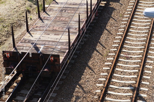 Open freight platforms for transporting large objects, on the railway track. 