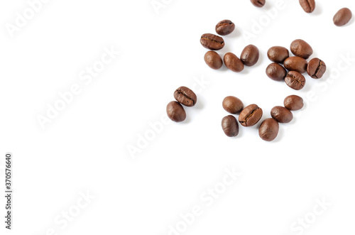 Roasted coffee beans on wooden texture background.