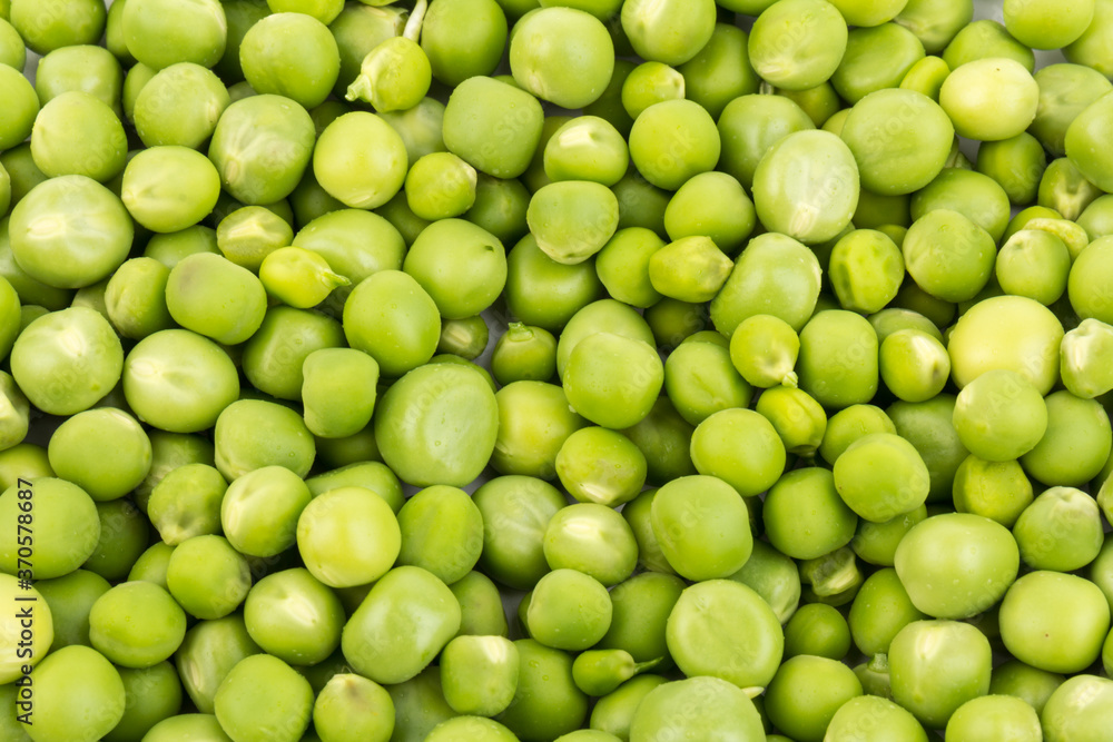 Green young peas, isolated on white background. Close-up. Top view Green young peas, isolated on white background. Close-up. Top view