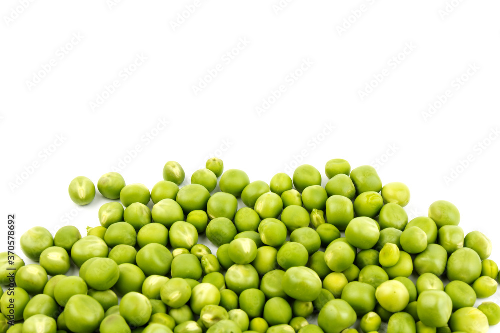 Green young peas, isolated on white background. Close-up. Top view Green young peas, isolated on white background. Close-up. Top view