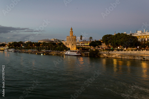 atardecer en sevilla, Torre del oro y rio guadalquivir photo