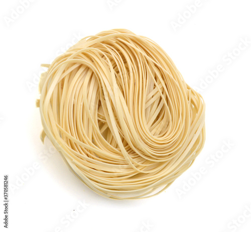 Egg noodles on a white background