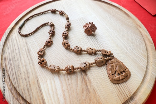 wooden jewelry. wood products. eco. wooden beads on a wooden background