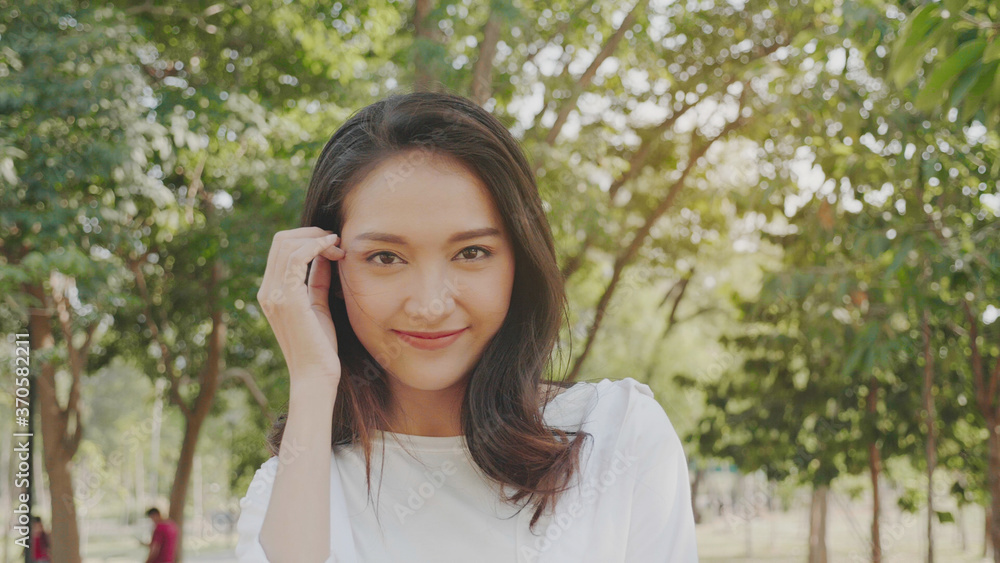 Authentic close up Happy pretty asian woman. Enjoy the nature in garden for summer. End of quarantine and return to Travel around the world Authentic close up Happy pretty asian woman. Enjoy the nature in garden for summer. End of quarantine and return to Travel around the world