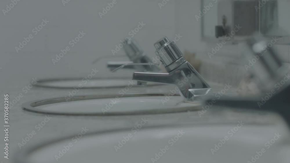 Close up of public restroom sink station interior Close up of public restroom sink station interior