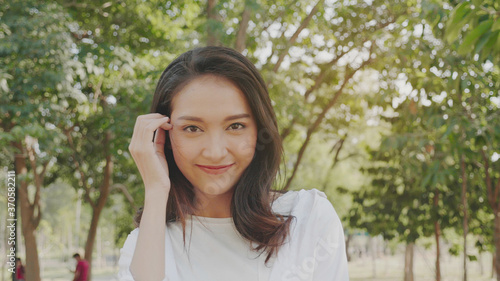 Authentic close up Happy pretty asian woman. Enjoy the nature in garden for summer. End of quarantine and return to Travel around the world