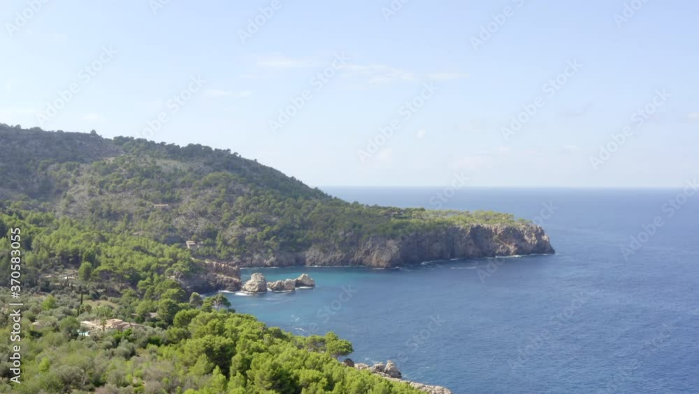 AERIAL: Over Beautiful Coast Line of Tropical Island Mallorca, Spain with ocean and Blue water in Summer,Daylight Vacation, Travel, Sunny, Waves AERIAL: Over Beautiful Coast Line of Tropical Island Mallorca, Spain with ocean and Blue water in Summer,Daylight Vacation, Travel, Sunny, Waves