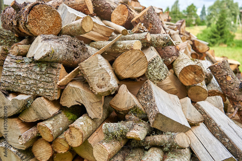 Close up of a stack of firewood outside withouth any protection  photo