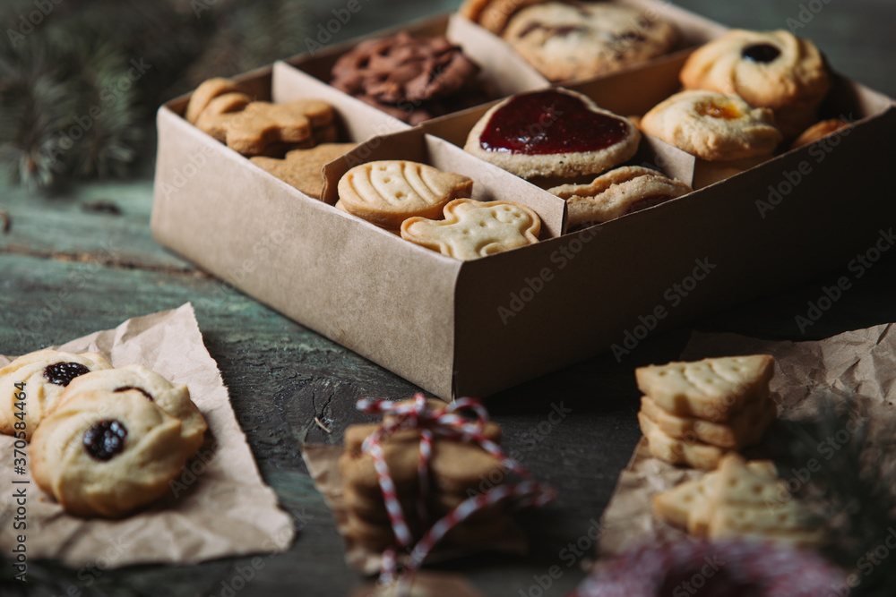 Fototapeta premium Box of Christmas cookies on rustic background