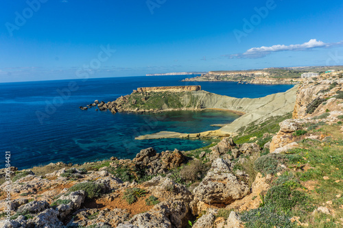 Hike by Golden Bay beach in Malta with beautiful blue ocean