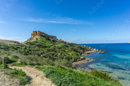 Hike by Golden Bay beach in Malta with beautiful blue ocean