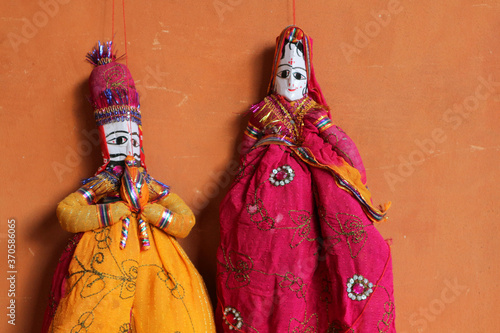 Indian traditional dolls on the wall in Jaipur.