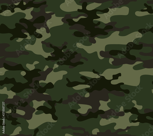 
Military green camouflage vector seamless pattern on textiles. Forest background.