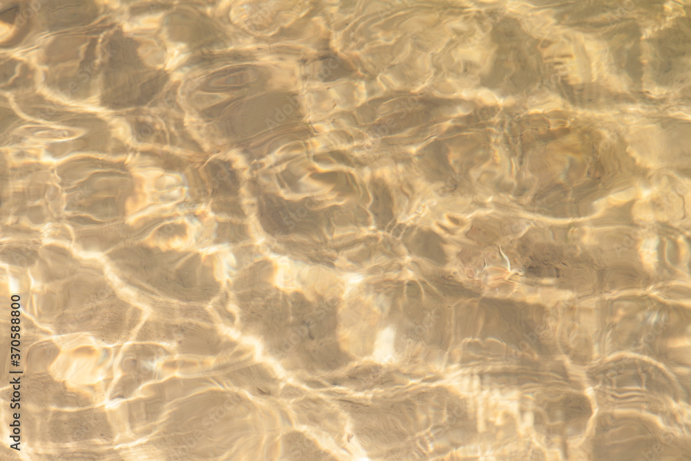 Sandy bottom under a layer of water texture background