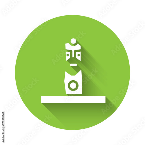 White Slavic pagan idol icon isolated with long shadow. Antique ritual wooden idol. Green circle button. Vector.