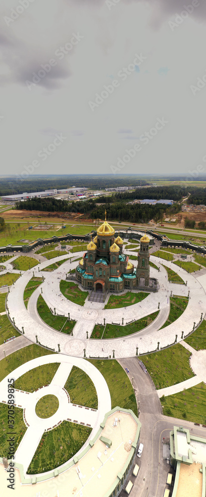 dark color temple with golden domes with geometric park from drone height