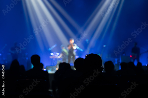 Texture blur and defocus entertainment concert lighting on stage,Integrated focus lights on the lead singer in the middle of the stage.