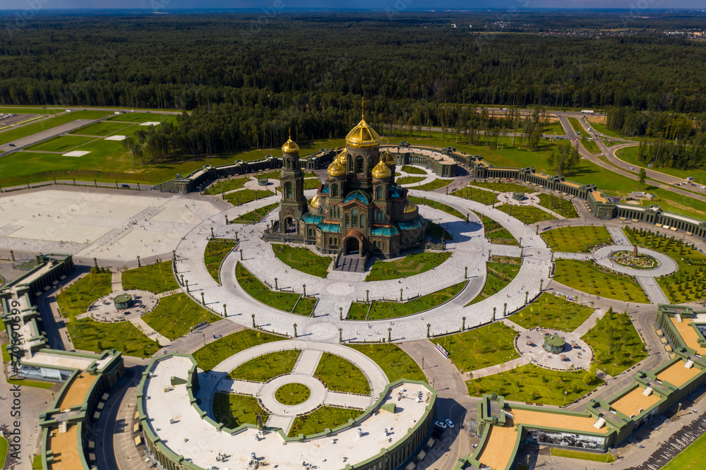 dark color temple with golden domes with geometric park from drone height