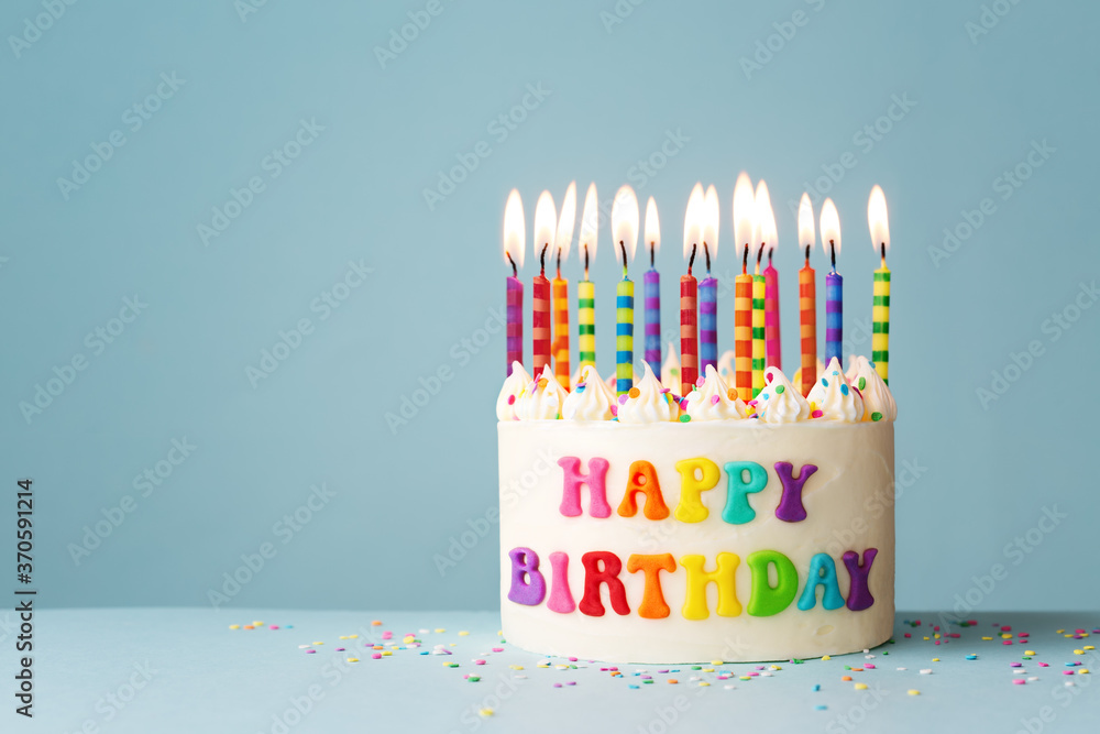 Colorful rainbow happy birthday cake ภาพถ่ายสต็อก Adobe Stock