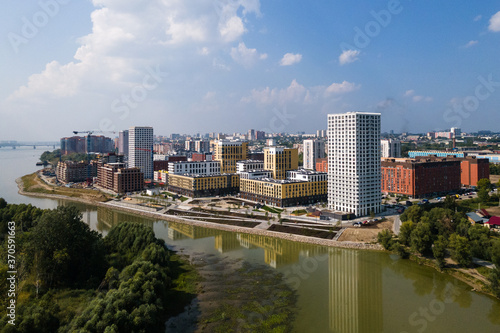 modern residential complex in a large city on the river bank. view from the plane