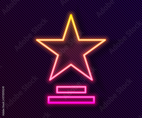 Glowing neon line Movie trophy icon isolated on black background. Academy award icon. Films and cinema symbol. Vector Illustration.