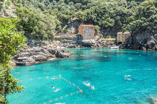 the bay of San Fruttuoso with green water and the abbey near the beach