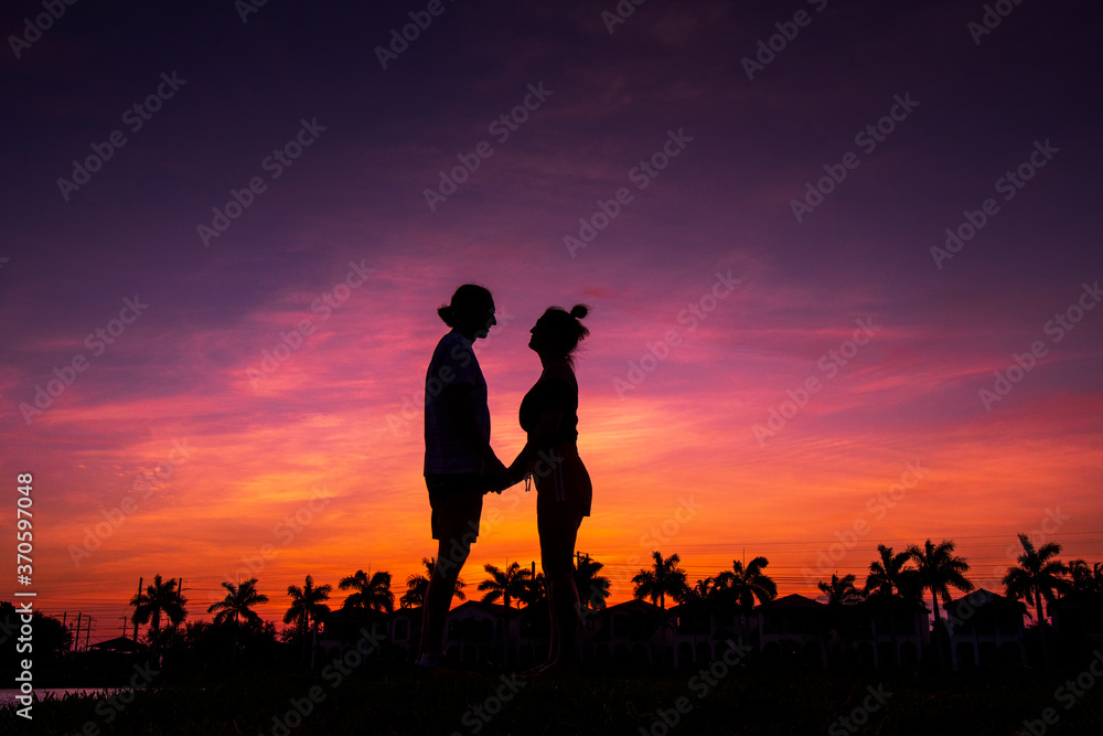 Silhouette of a couple on sunset