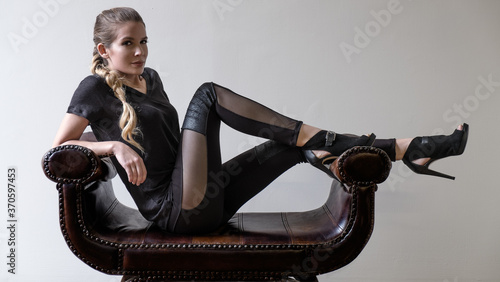 Photography young woman in black leggings