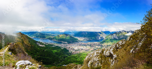 Tableau sur toile Wide panoramic view of the city of Lecco , Lake Como and lake Garlate  from the height of the mountain Resegone