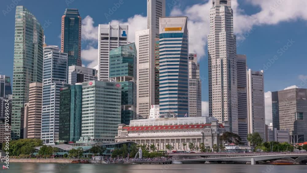 Business Financial Downtown City and Skyscrapers Tower Building at Marina Bay timelapse, Singapore, Cityscape Urban Landmark and Business Finance District Center reflected in water Business Financial Downtown City and Skyscrapers Tower Building at Marina Bay timelapse, Singapore, Cityscape Urban Landmark and Business Finance District Center reflected in water