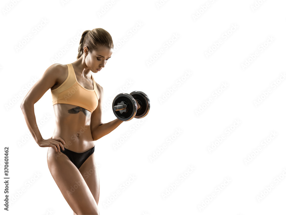 Fototapeta premium young fitness woman with dumbbells