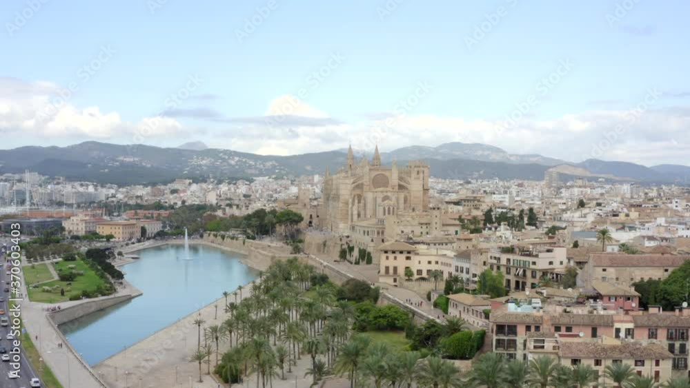 AERIAL: Palma Cathedral Wide shot in Daylight, Blue Sky with Traffic and Tourists on Tropical Island Mallorca, Spain on Sunny Day Vacation, Travel, Sunny AERIAL: Palma Cathedral Wide shot in Daylight, Blue Sky with Traffic and Tourists on Tropical Island Mallorca, Spain on Sunny Day Vacation, Travel, Sunny