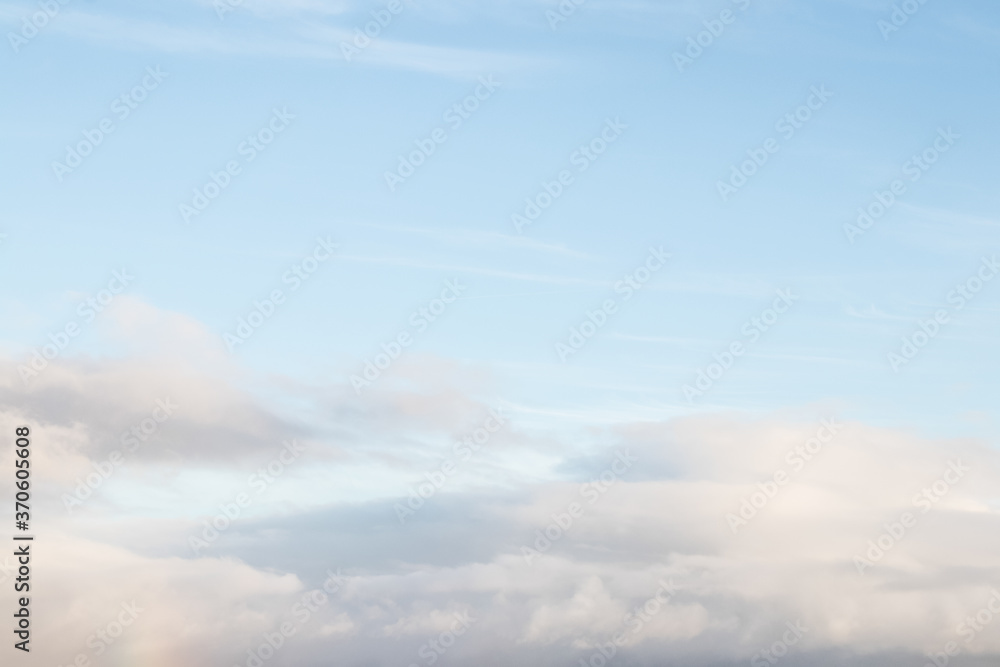 Blue sky with clouds background with soft focus. Empty sky background for your design. Spring background.