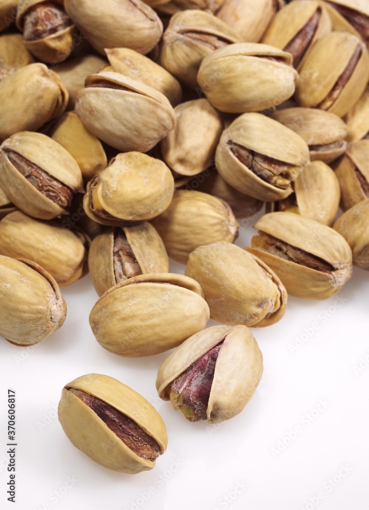 Pistachio Nuts, pistacia vera, Dry Fruits against White Background