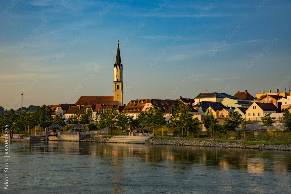 Danube River and a church with a clock tower near Passau Germany