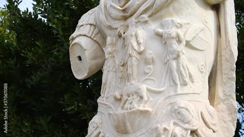 Close up shot of an armless ancient greek statue with Romulus and Remus photo