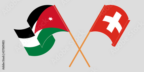 Crossed and waving flags of Jordan and Switzerland