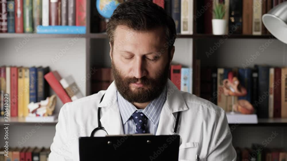 Doctor falls asleep at workplace. Very tired or sleepless male doctor ...