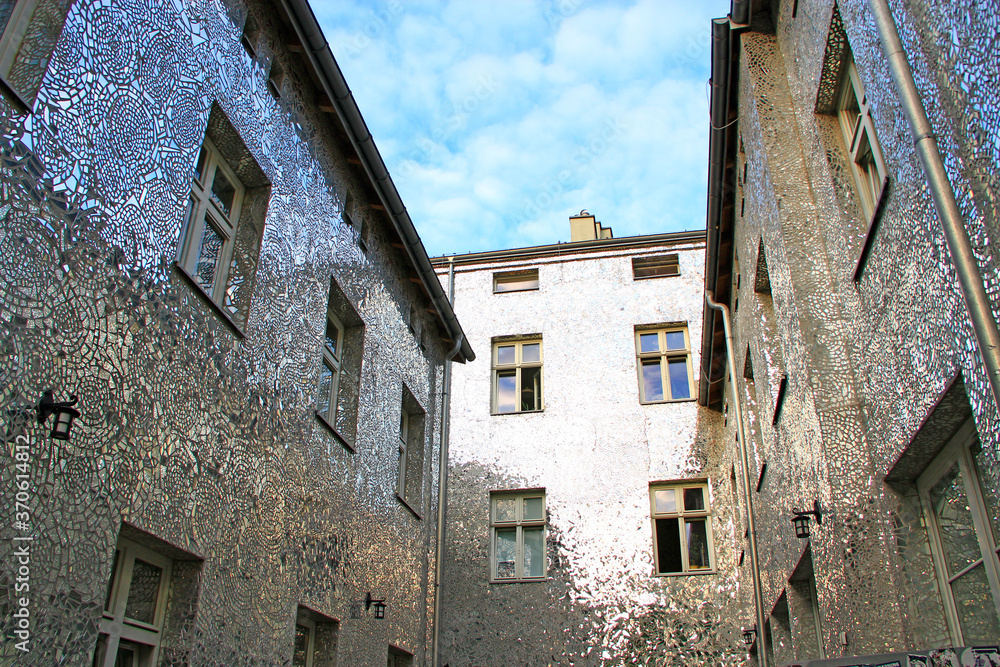 Building with mirrored walls. Facade of building made of mirror fragments Building with mirrored walls. Facade of building made of mirror fragments