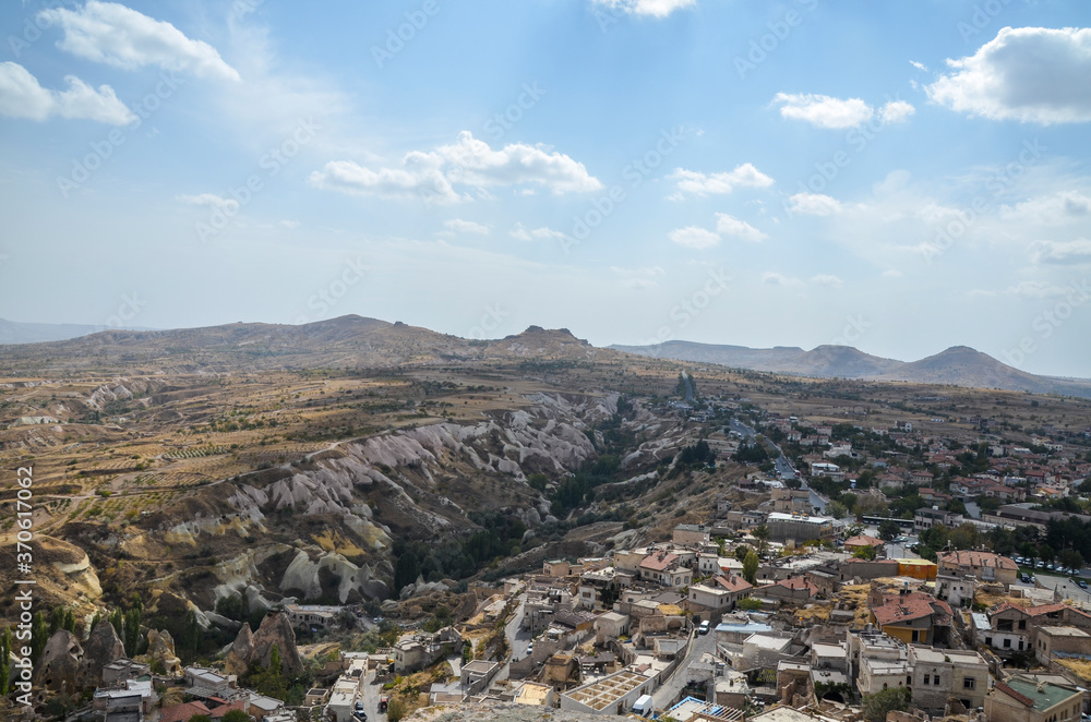 Amazing view to the cave town Uchisar from the ancient mountain fortress. Cappadocia, Turkey.