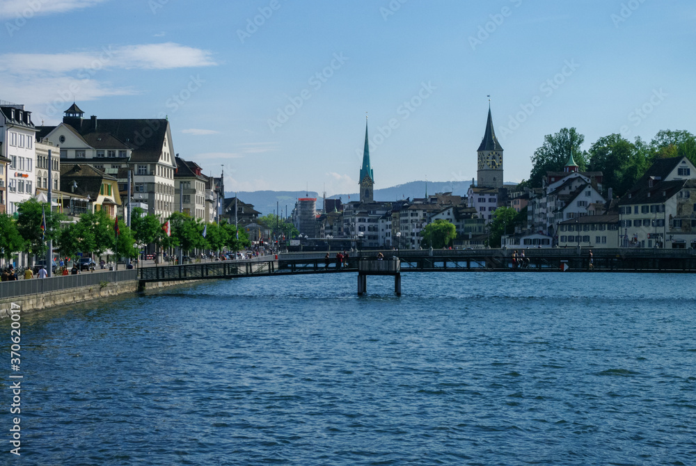 View of historic Zurich city center with famous St. Peter and Fraumunster churches, Limmat river. Switzerland