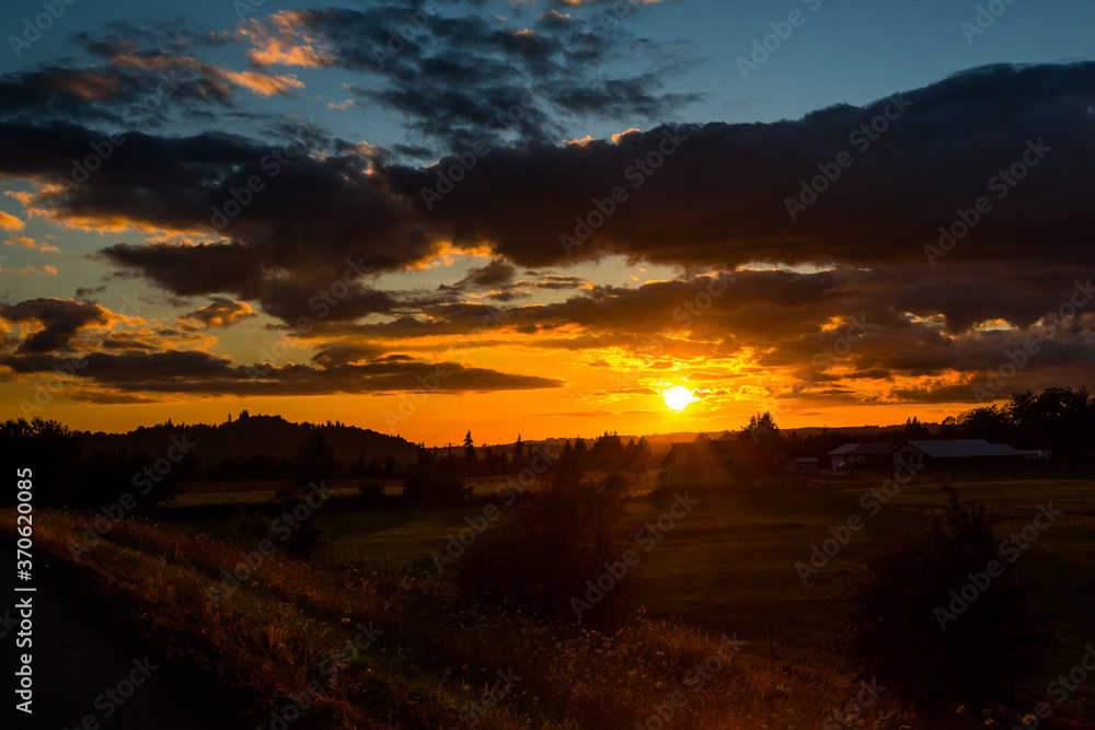 Beautiful colorful clouds at sunset in summer season in countryside