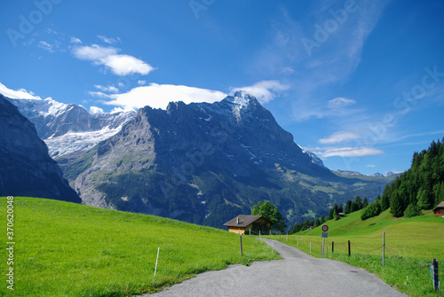 Sunny day view to the mountains vally and Mittelhorn and Mattenberg summit from road to First (Grindelwald)  (Jungfrau region, Bern, Switzerland)