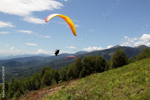 Belice, Italy - summer 2020: Italian paragliding championship, a competitor takes the chase for take-off