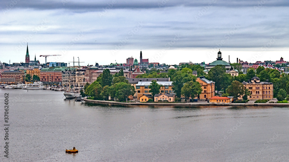 Fototapeta premium Panoramic view of different parts of Stockholm from the observation deck, cloudy summer day with blurry small fragments in the corners of the card