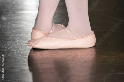 Young ballerina's feet in the fifth ballet position