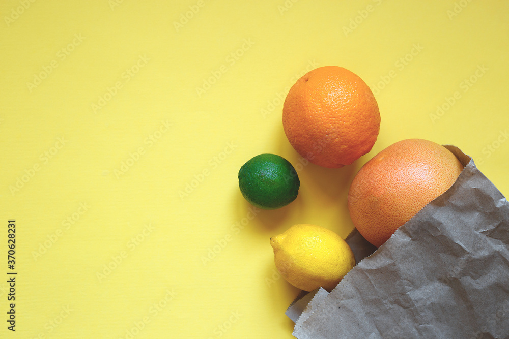 juicy ripe citrus fruits in an eco-friendly shopping bag juicy ripe citrus fruits in an eco-friendly shopping bag